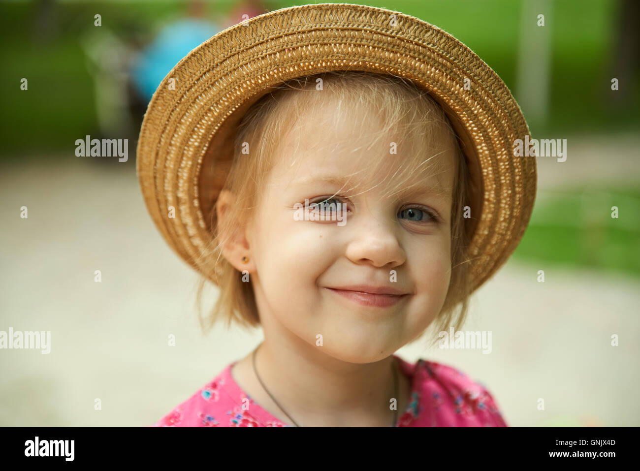 Cute kid girl wearing hat outdoors Stock Photo Alamy