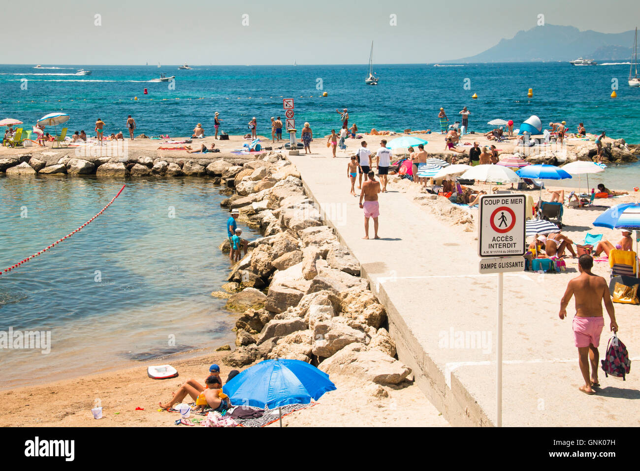 CANNES, FRANCE JULY 2016 People on the beach in the popular holiday