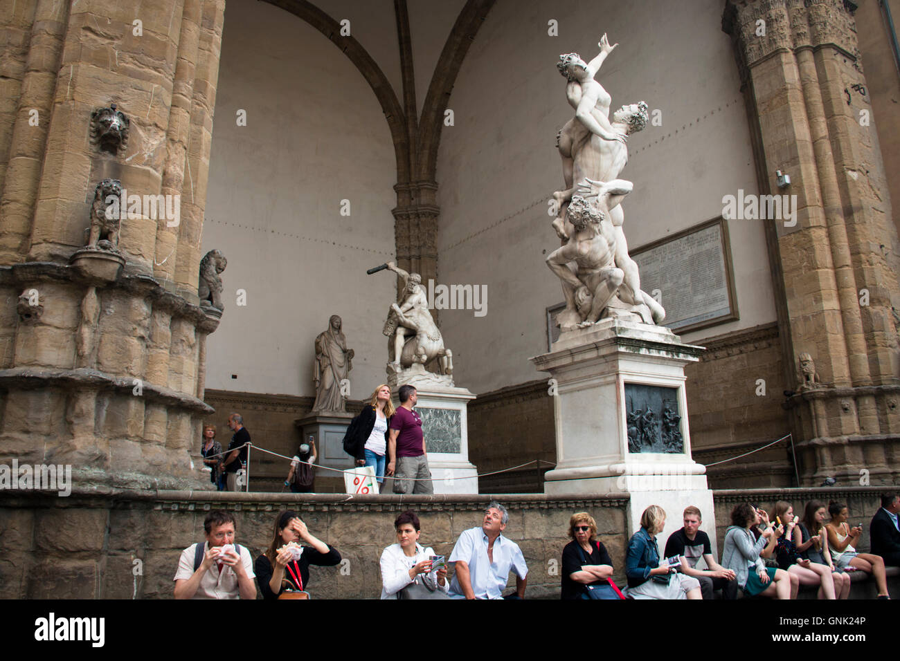 FLORENCE, ITALY JULY 2016 Several statues with people on the piazza