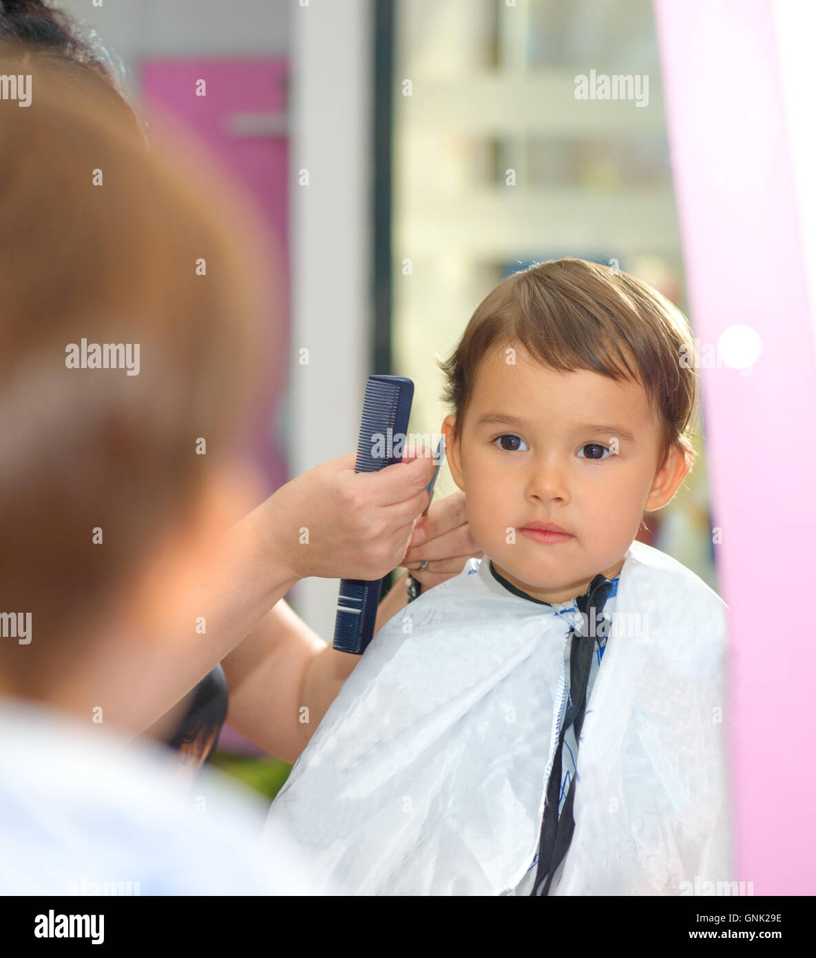 Toddler child getting his first haircut Stock Photo