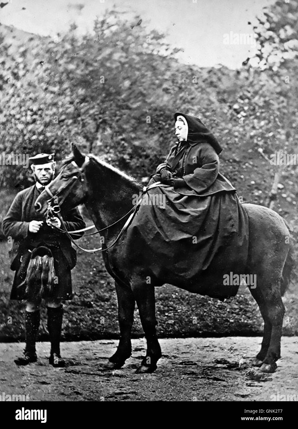 QUEEN VICTORIA (1819-1901) English monarch on her horse 'Fyvie'with John Brown at Balmoral in 1863. Photo George Wilson Stock Photo