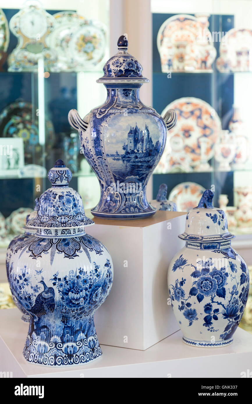 Delft Blue luxury old hand-painted porcelain goods - urns and vases - at Royal Delft Experience shop in Amsterdam, Holland Stock Photo