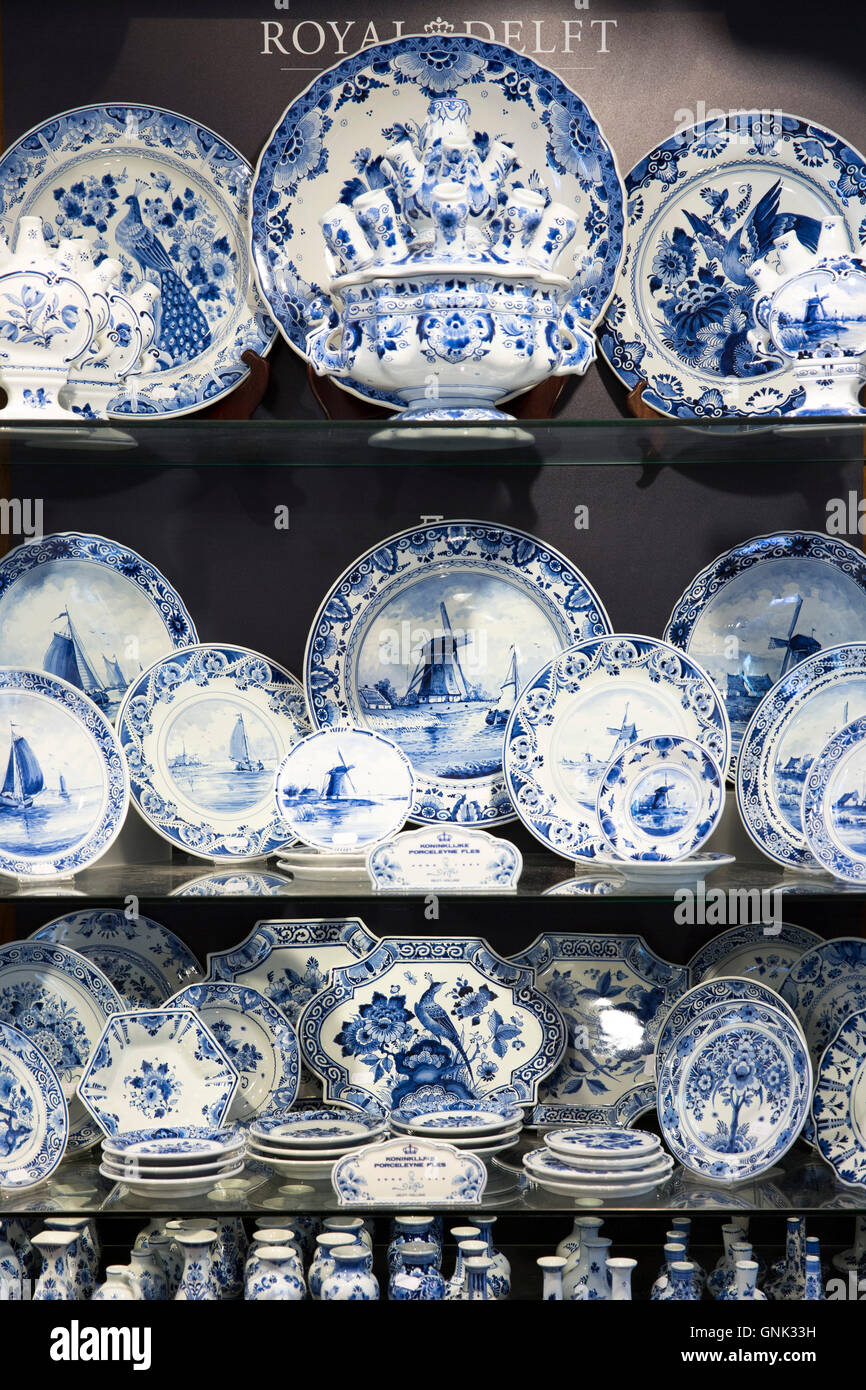 Delft Blue luxury hand-painted porcelain plates and dinner service at Royal Delft Experience shop in Amsterdam, Holland Stock Photo