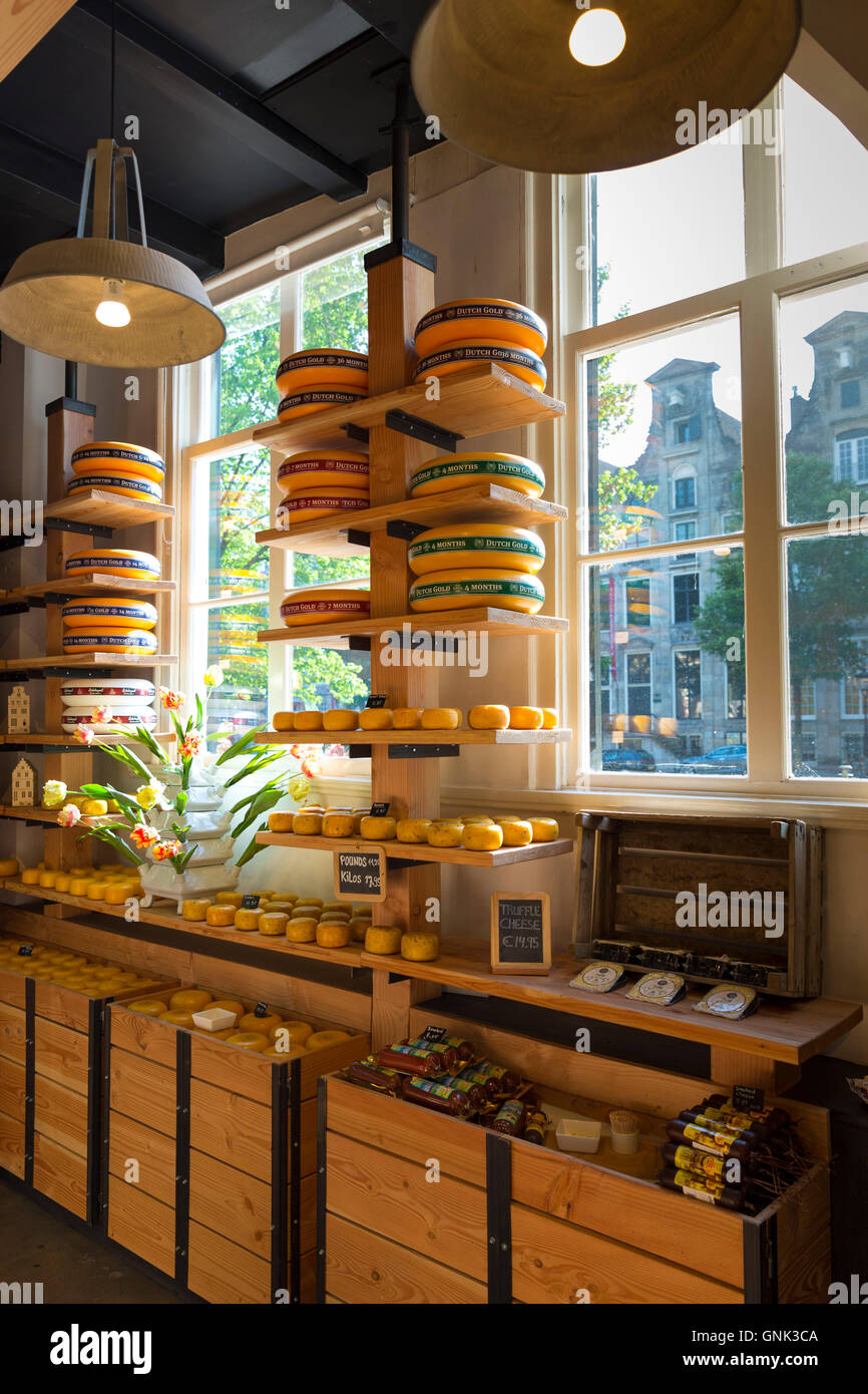 Traditional Gouda cheese wheels on sale in Dutch cheese shop in the Jordaan district of  Amsterdam, Holland Stock Photo