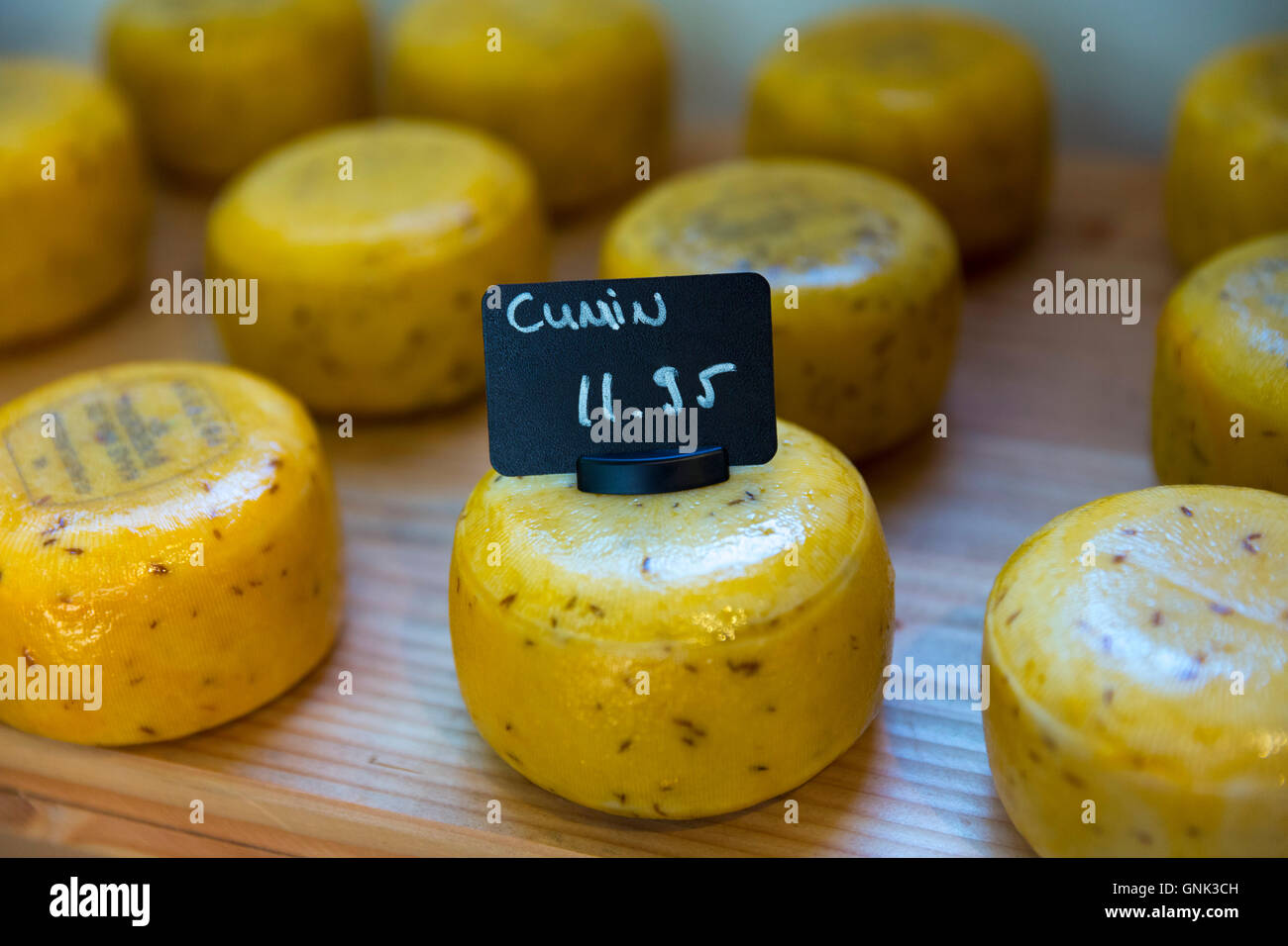 Cumin flavour Gouda cheese Euro prices in Dutch cheese shop in Jordaan district, Amsterdam, Holland Stock Photo
