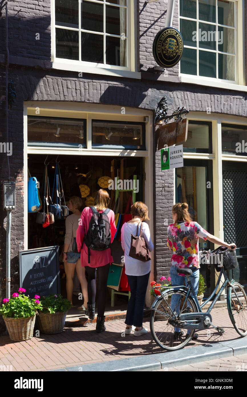 Young women shopping in ladies fashion shop in the Nine Streets shopping district, Amsterdam Stock Photo