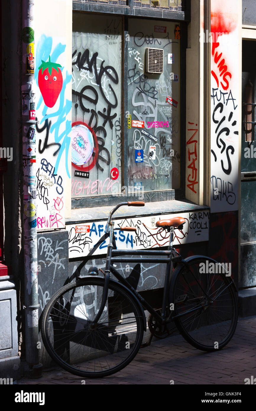 Graffiti on shop front in the Nine Streets shopping district, Amsterdam Stock Photo