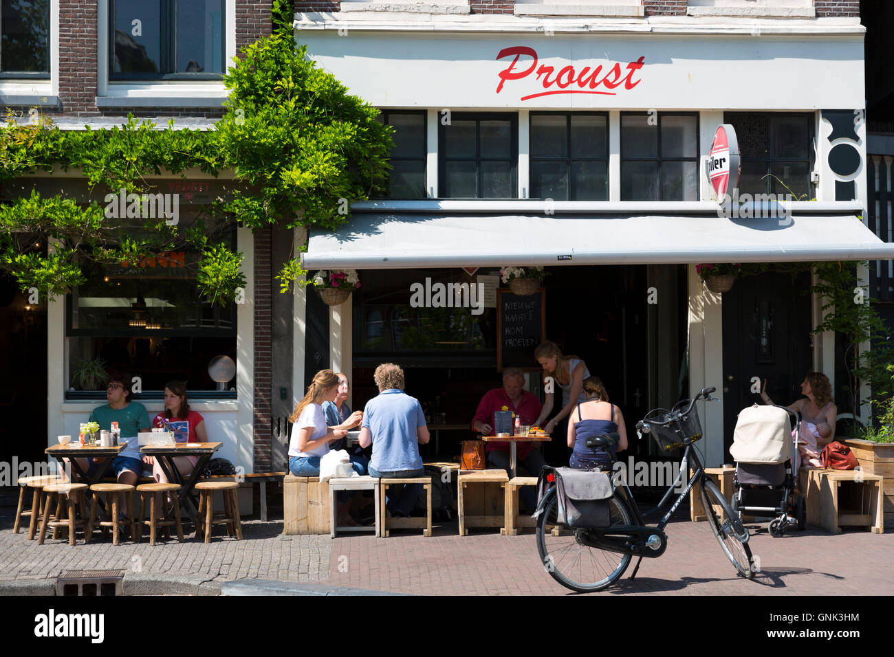 Locals and tourists dining at bar restaurant Cafe Proust in the  Noordermarkt - Northern Market area of Jordaan, Amsterdam Stock Photo -  Alamy