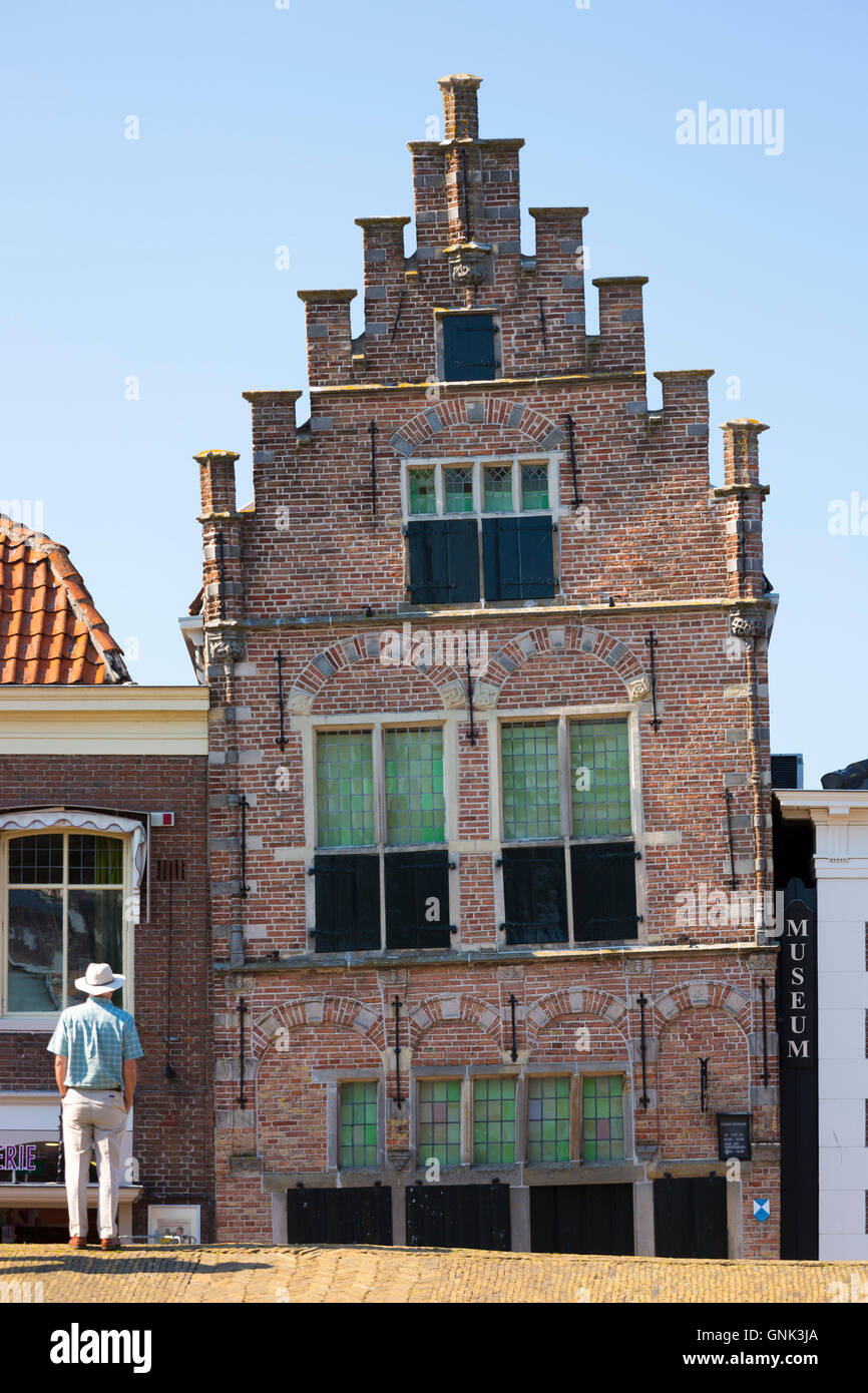 Tourist views traditional architecture lopsided ancient building of theTown Hall and Museum, Edam, The Netherlands Stock Photo