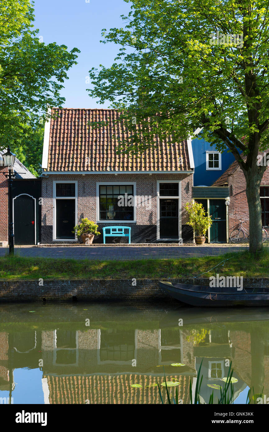 Quaint houses facades alongside the canal waterway in the town of Edam, The Netherlands Stock