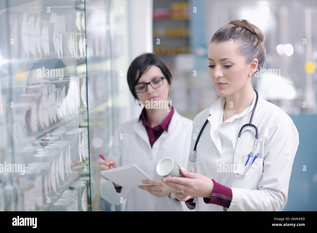 team of pharmacist chemist woman in pharmacy drugstore Stock Photo - Alamy