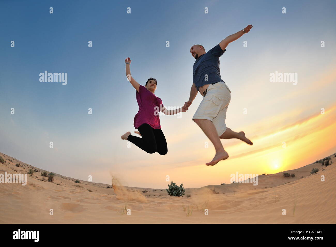 couple enjoying the sunset Stock Photo - Alamy