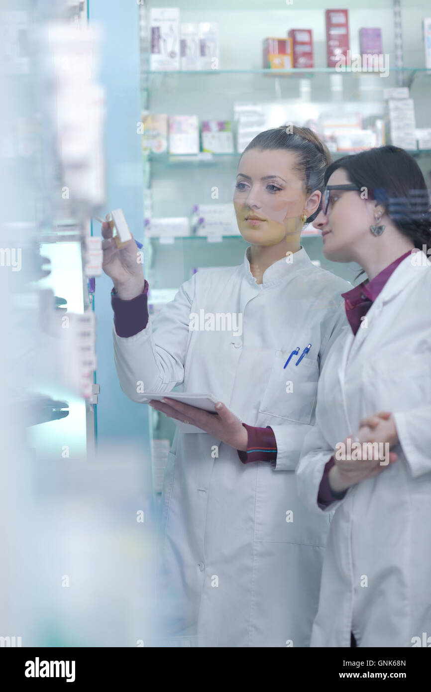 team of pharmacist chemist woman in pharmacy drugstore Stock Photo - Alamy