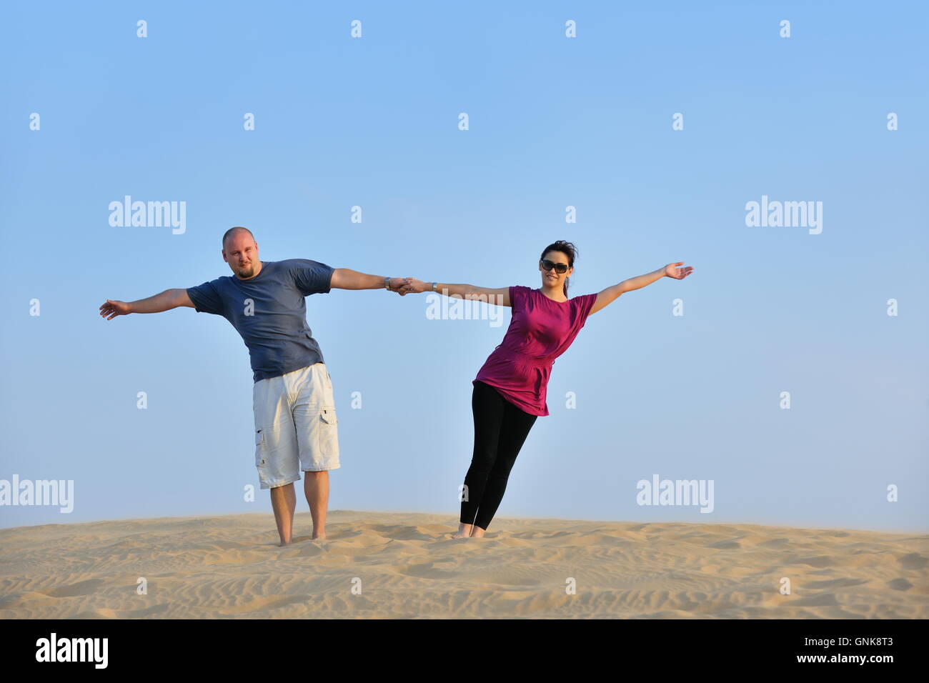 couple enjoying the sunset Stock Photo - Alamy