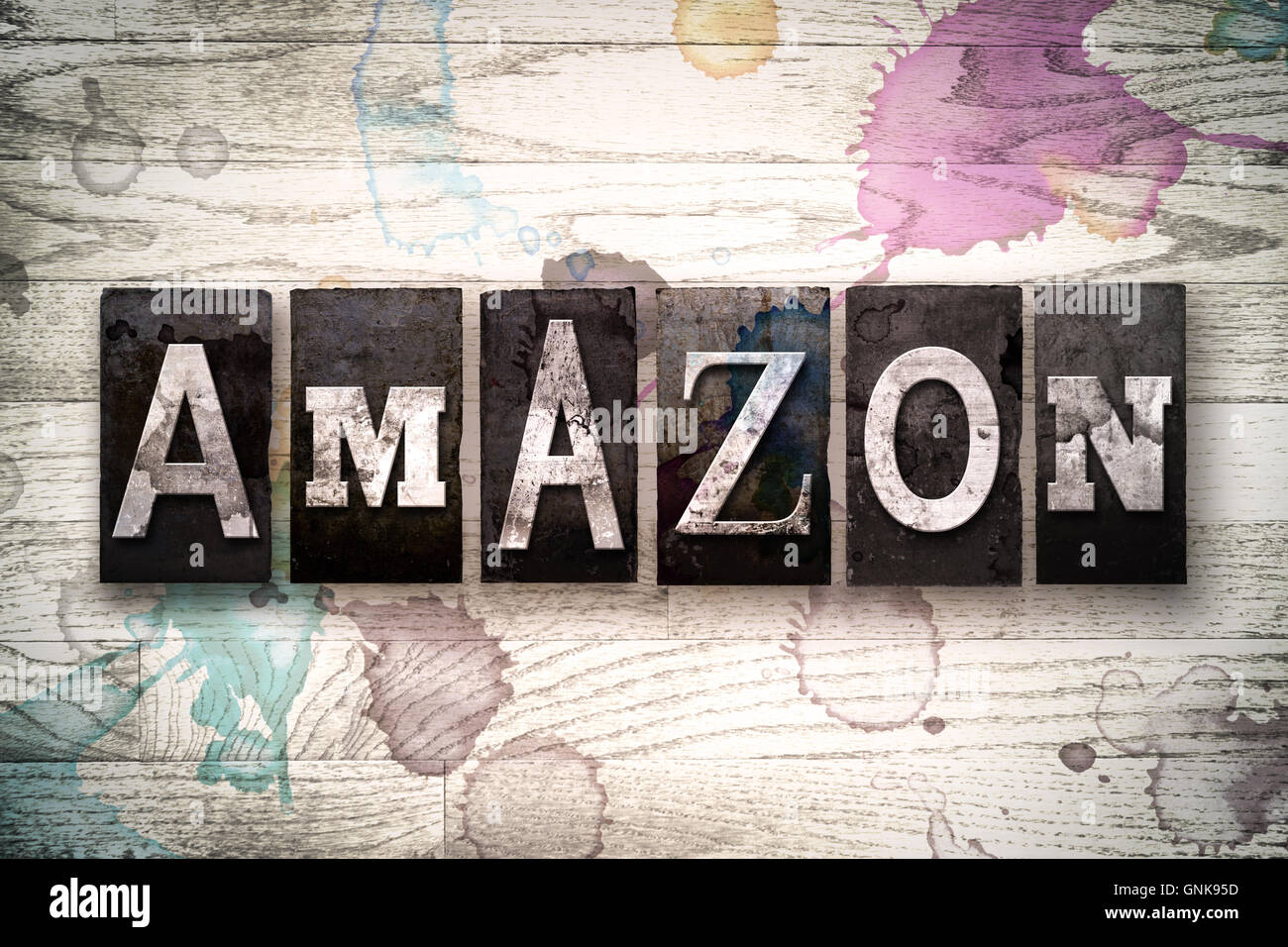 The word "AMAZON" written in vintage, dirty metal letterpress type on a whitewashed wooden