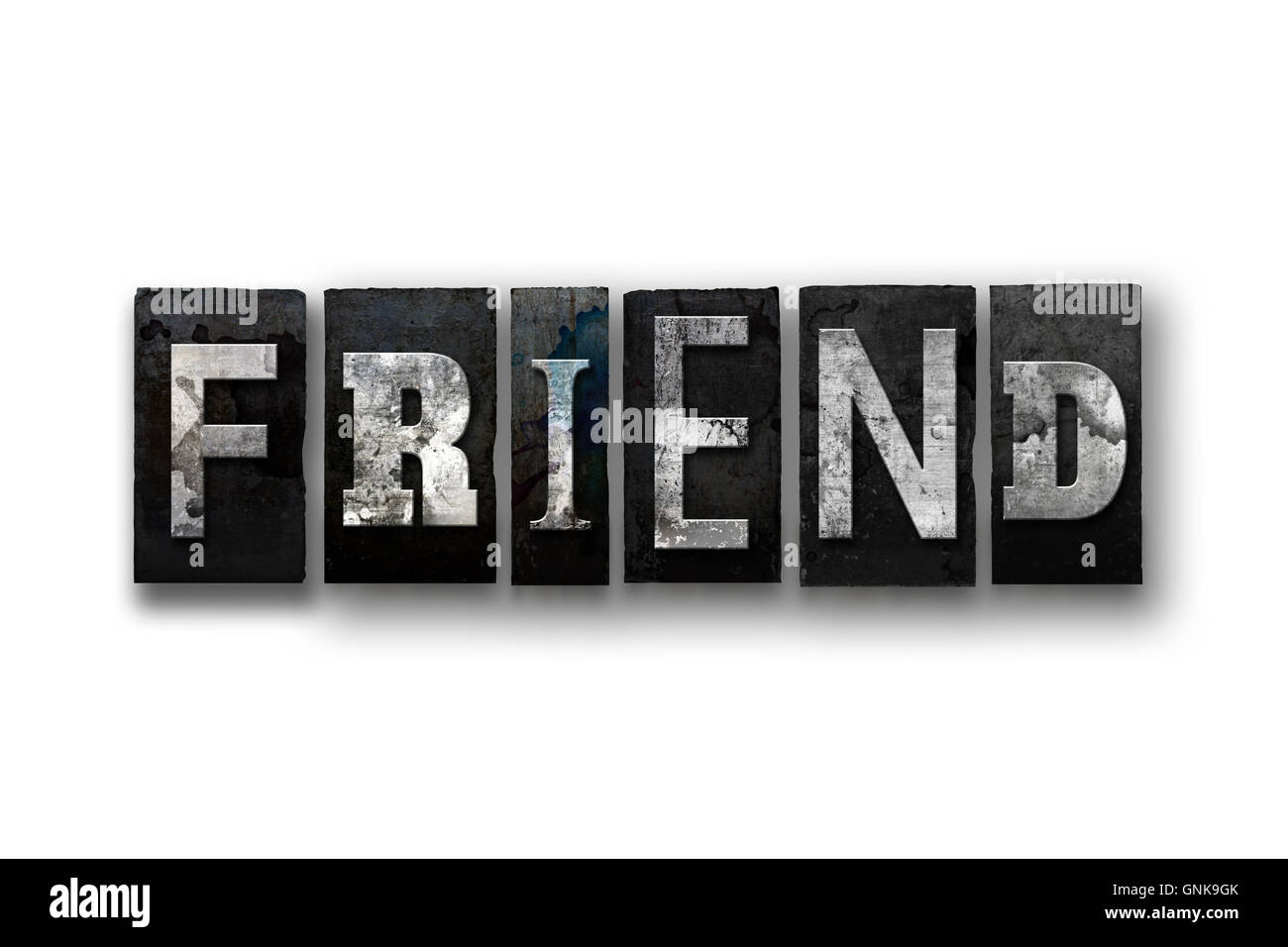The word 'FRIEND' written in vintage, dirty, ink stained letterpress type and isolated on a white background. Stock Photo