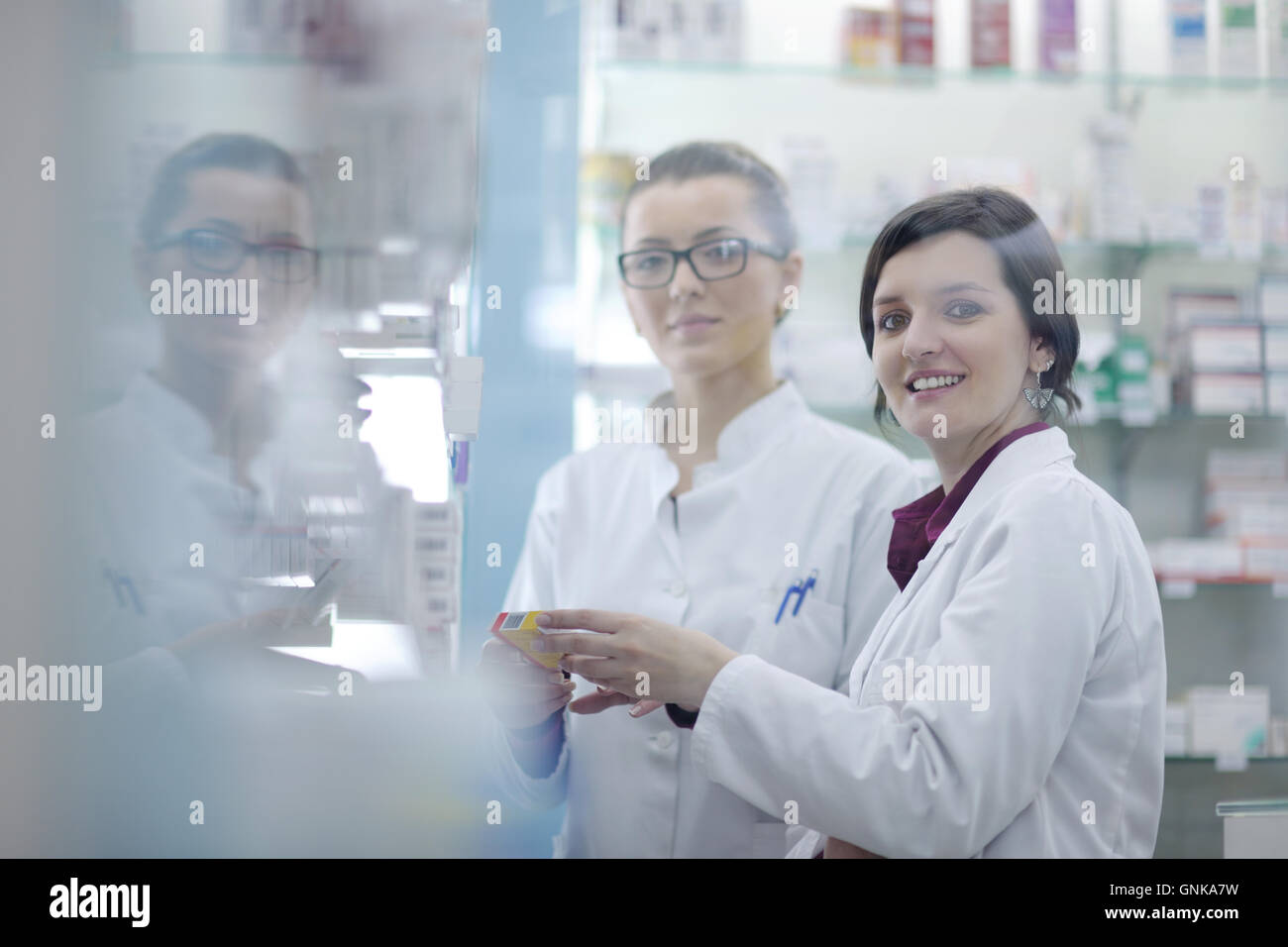 team of pharmacist chemist woman in pharmacy drugstore Stock Photo - Alamy