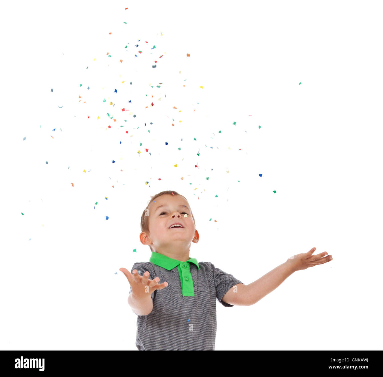 Boy having fun with confetti Stock Photo