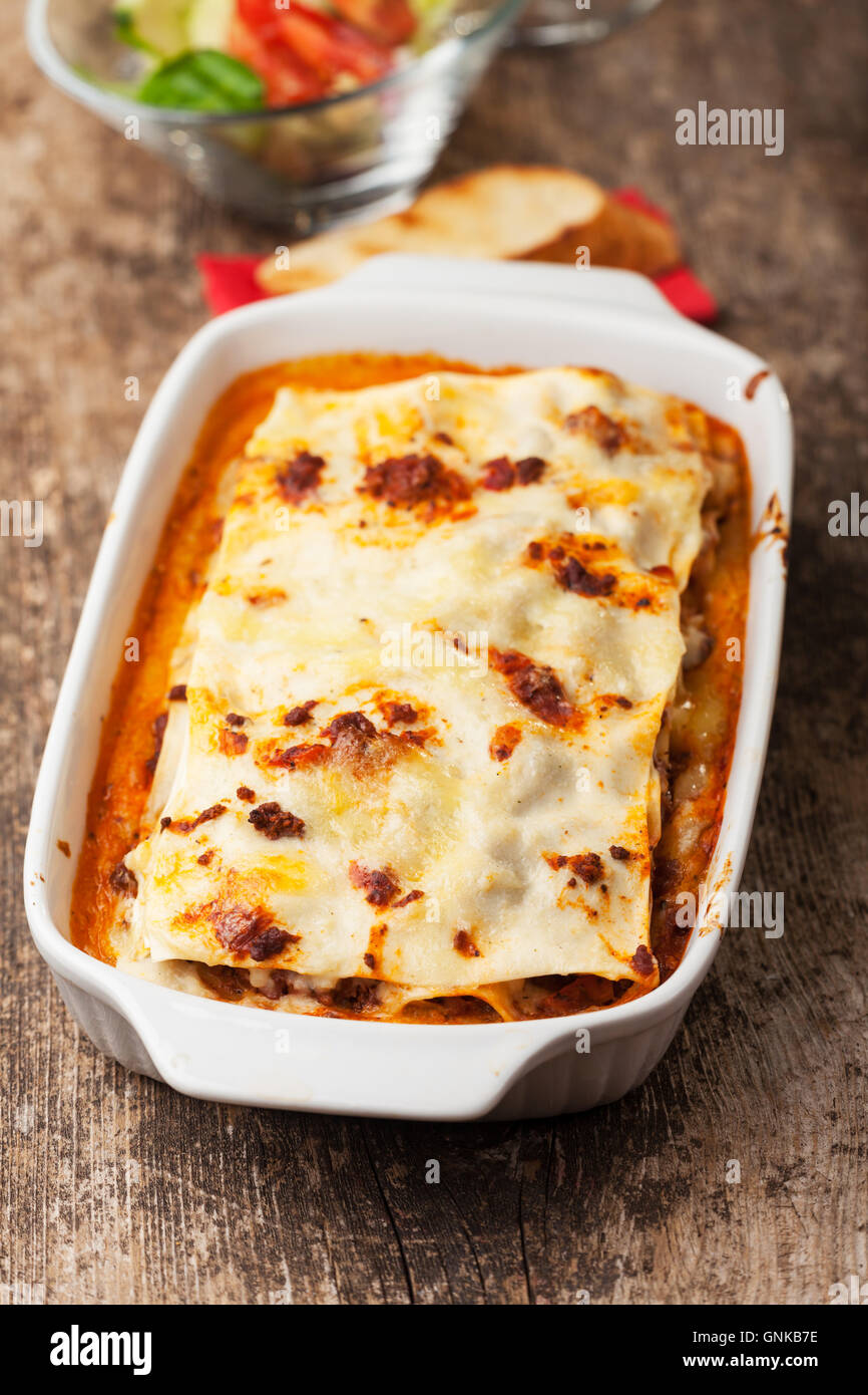 italian lasagna on a square plate Stock Photo - Alamy