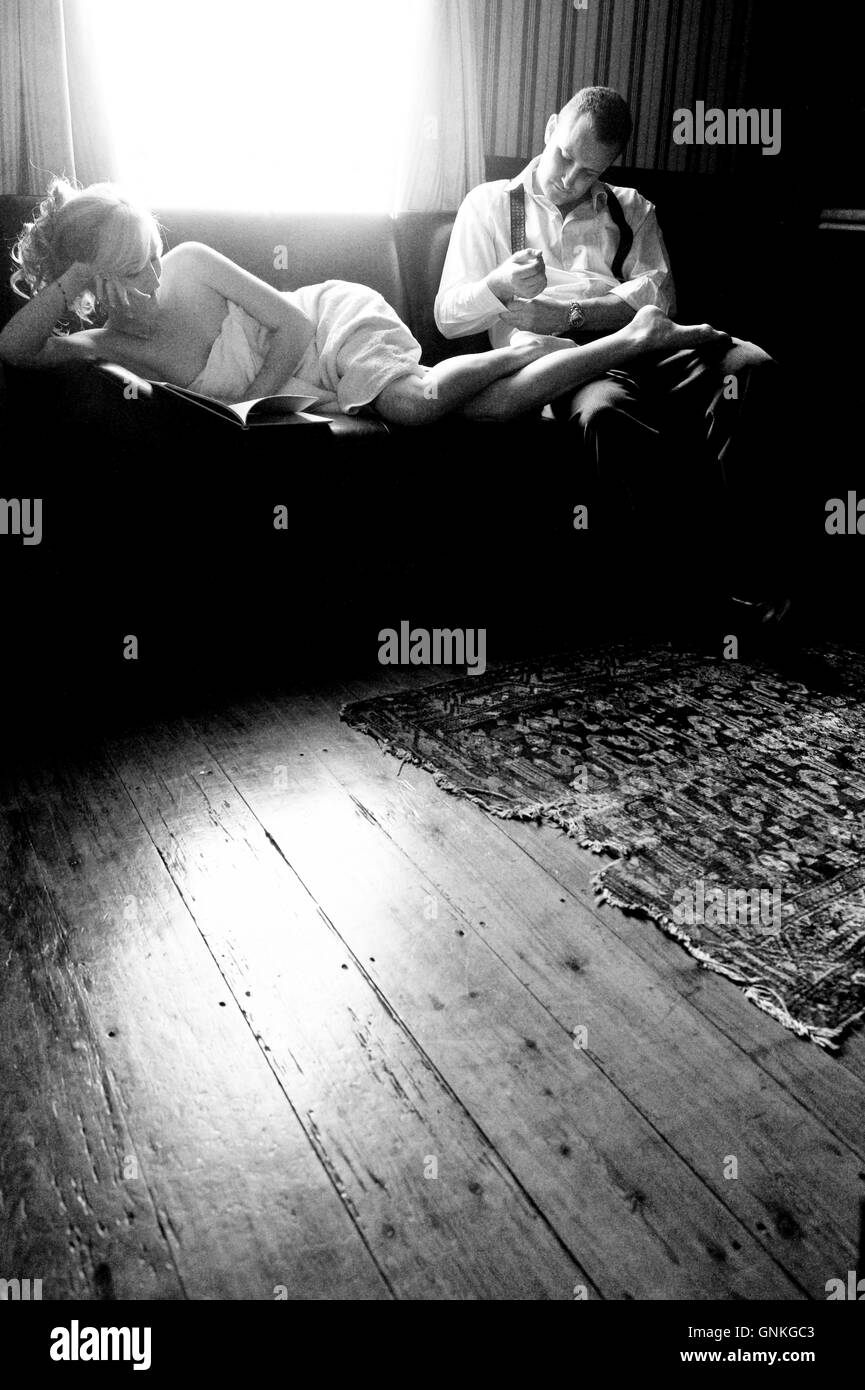 Woman lying on sofa Black and White Stock Photos & Images Alamy