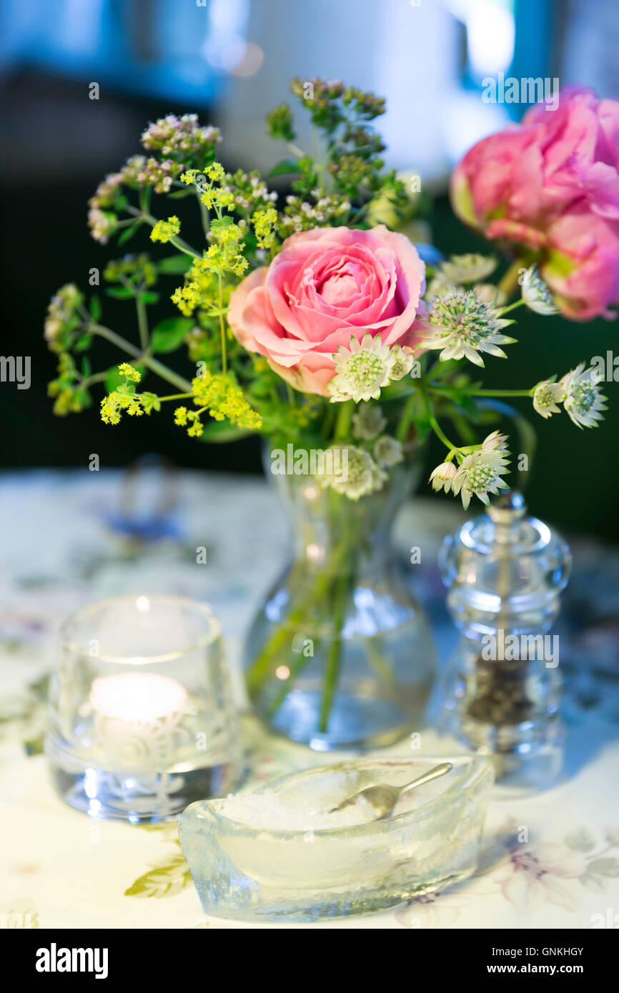 Salt, pepper and vase of flowers at Sonderho Kro Hotel and Restaurant quaint style on Fano Island, Denmark Stock Photo