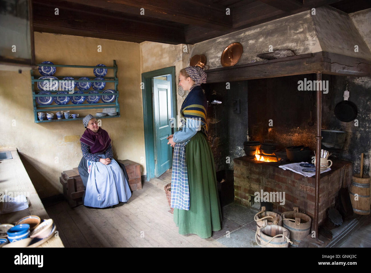 Costume characters and interior at Den Gamle By, The Old Town, open-air folk museum at Aarhus,  East Jutland, Denmark Stock Photo