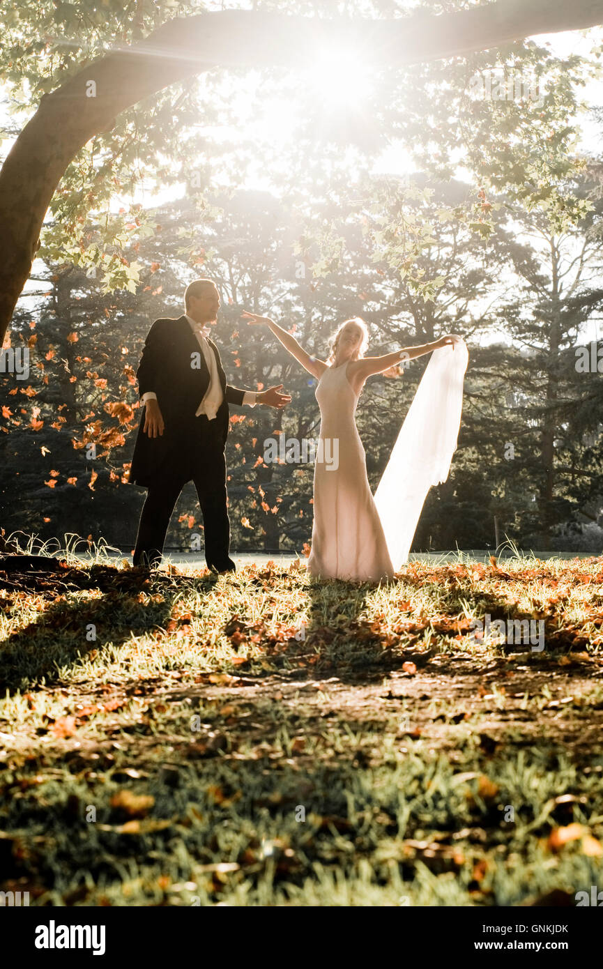 Bride and groom dancing in a forest Stock Photo - Alamy