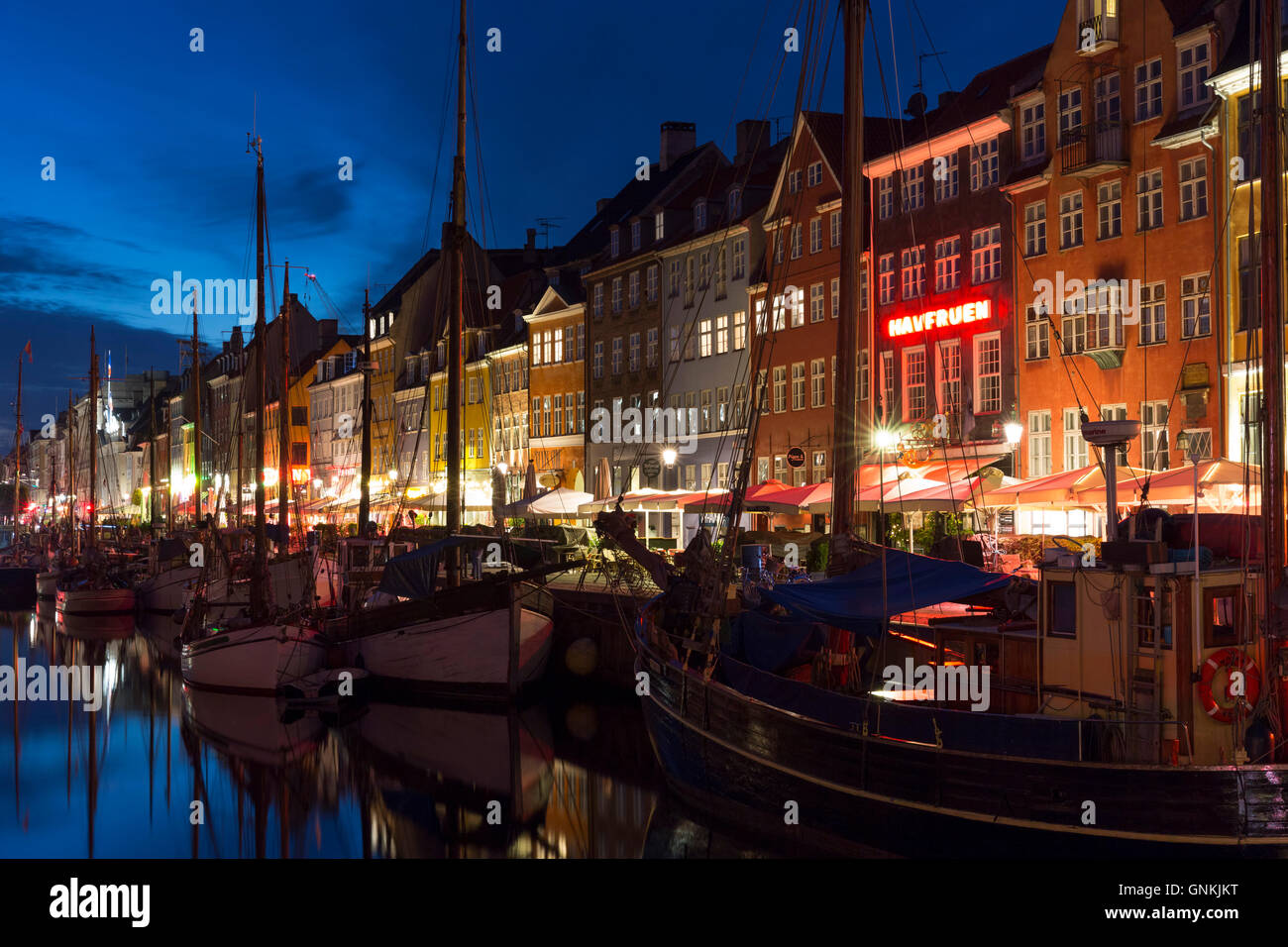 Nightlife in the famous Nyhavn, old canal harbour in Copenhagen on Zealand, Denmark Stock Photo
