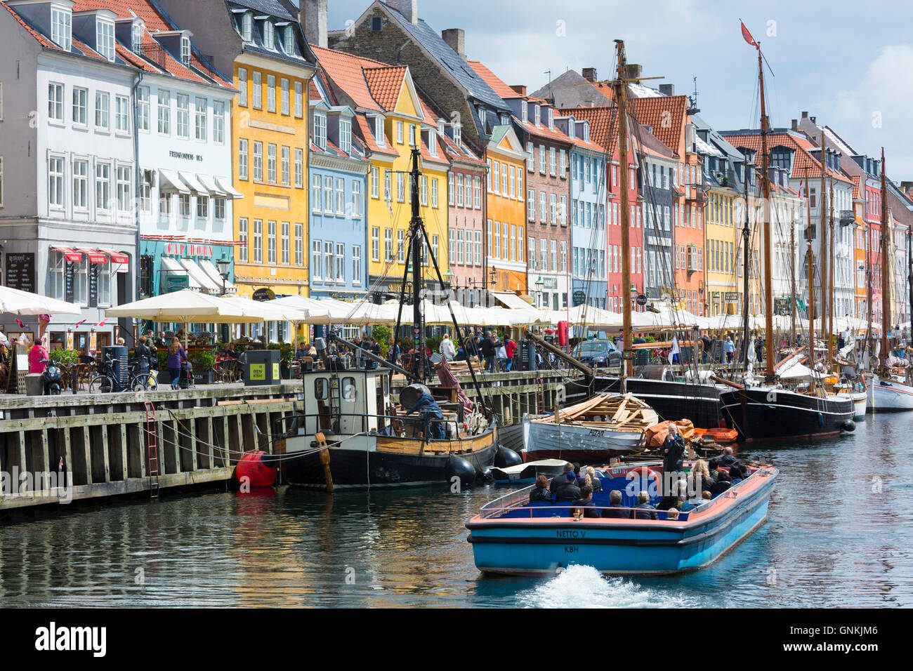 Sailing boats at famous Nyhavn, 17th Century waterfront canal and entertainment district in Copenhagen, Denmark Stock Photo
