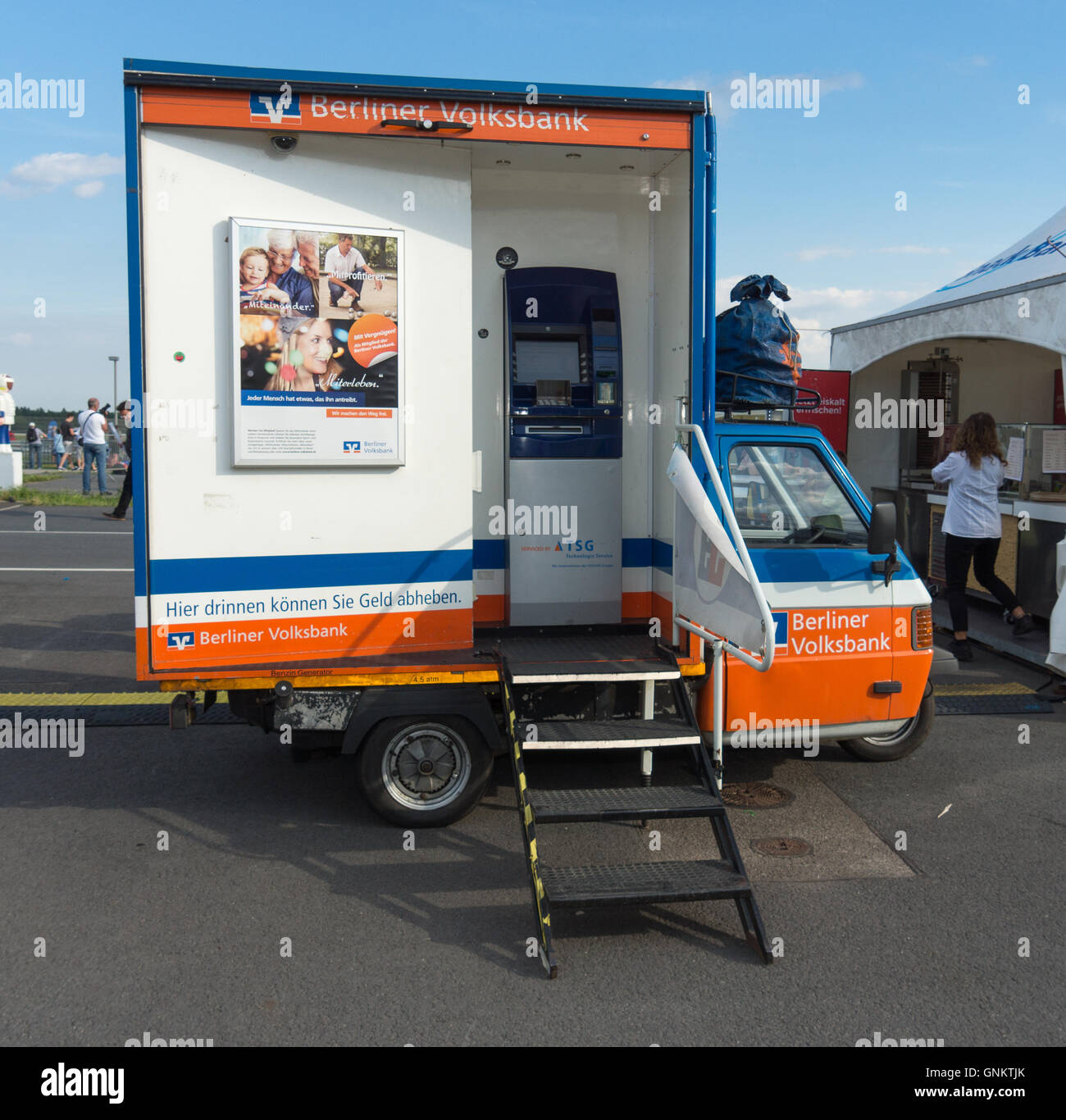 BERLIN, GERMANY - JUNE 03, 2016: Mobile ATM of the bank 'Berliner Volksbank' on the basis of car Piaggio Ape. Stock Photo
