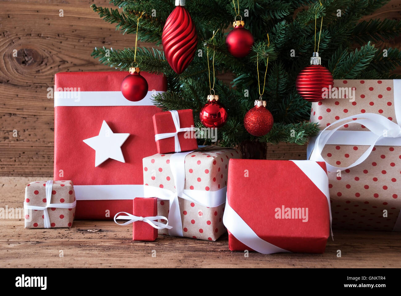 Christmas Tree With Gifts And Balls Stock Photo - Alamy
