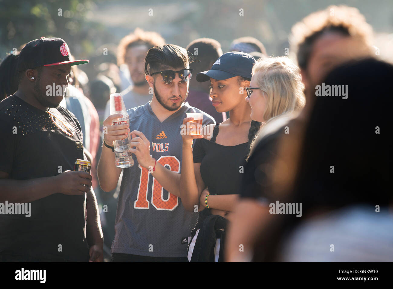 People drinking at The Notting Hill Carnival in London Stock Photo