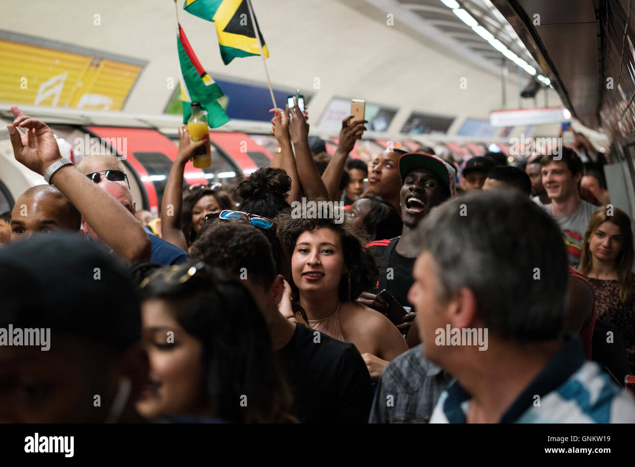 Crowds getting off the tube for The Notting Hill Carnival in London Stock Photo