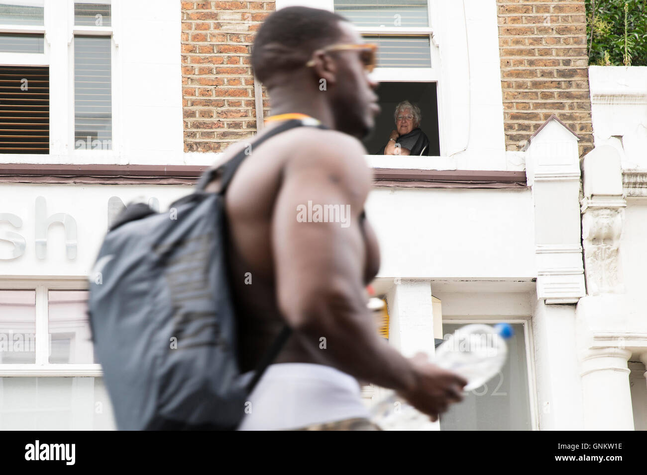 Residents watching revellers at Notting Hill Carnival in London Stock Photo