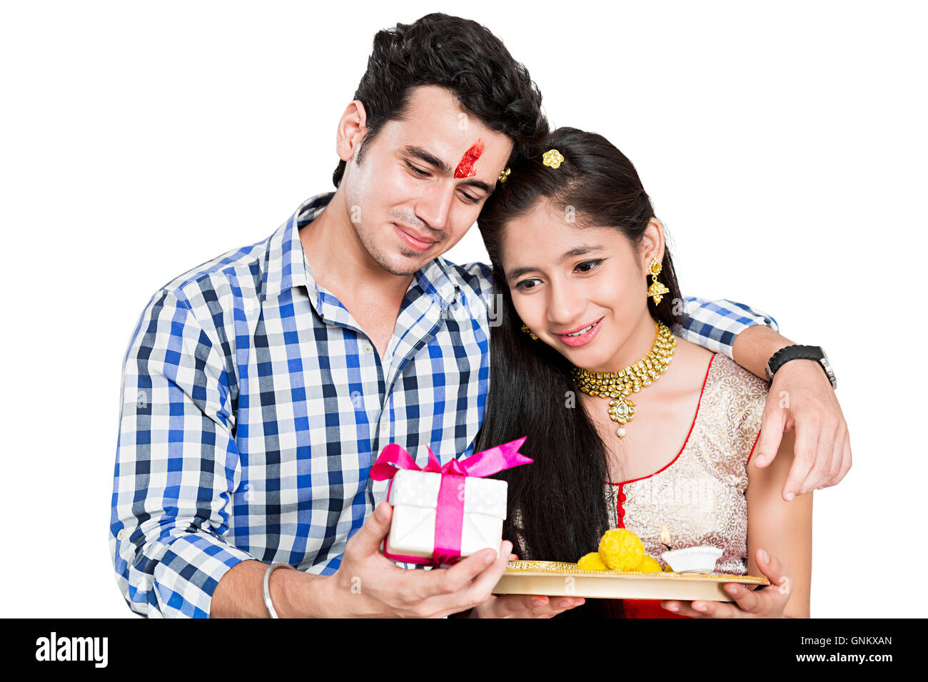 2 indian Teenagers Brother and Sister Raksha Bandhan Festivals Giving gift Stock Photo