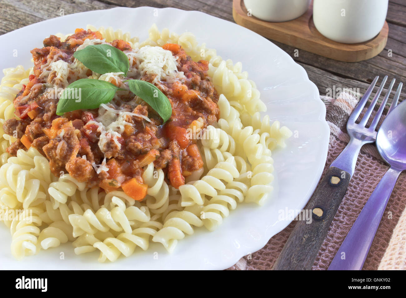 Fusilli pasta with bolognese sauce on kitchen table Stock Photo Alamy
