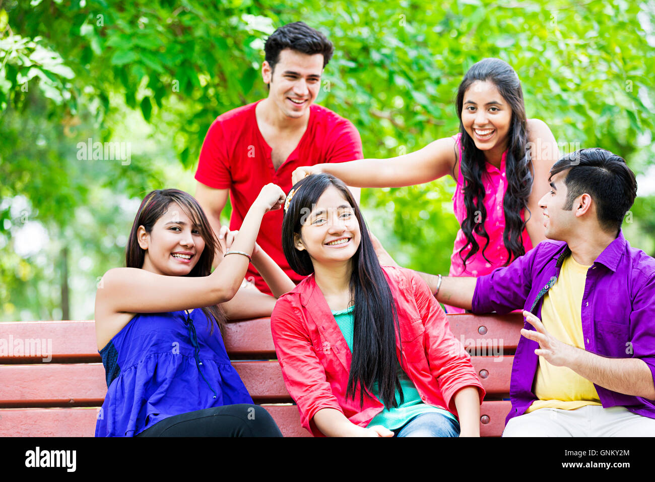 Young indian man sitting bench hi-res stock photography and images - Alamy