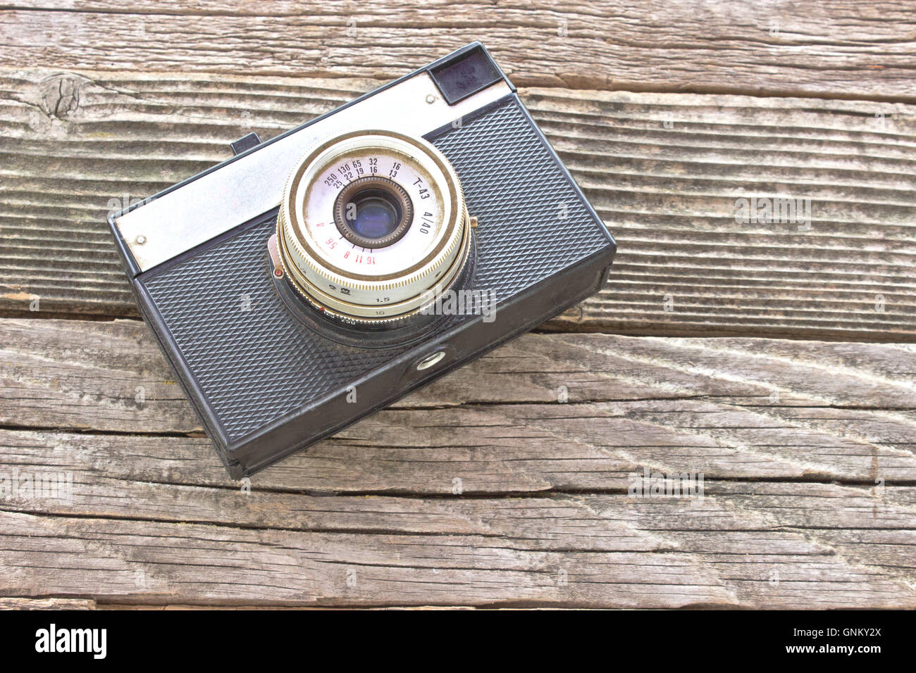 Vintage film photo camera on wooden background Stock Photo