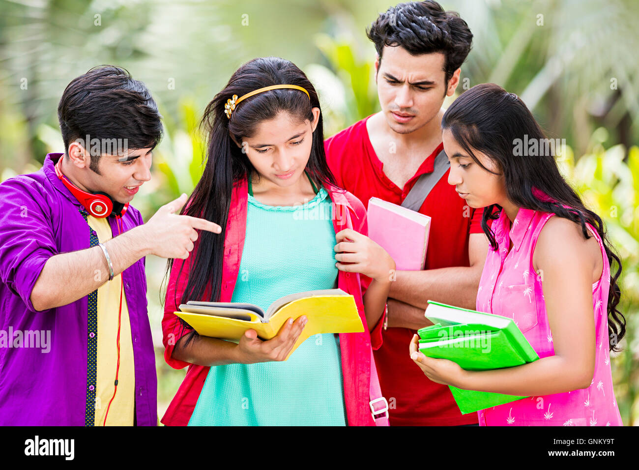 5 Young Girls and Boys Friends College Student Park Standing  Book Studying Stock Photo