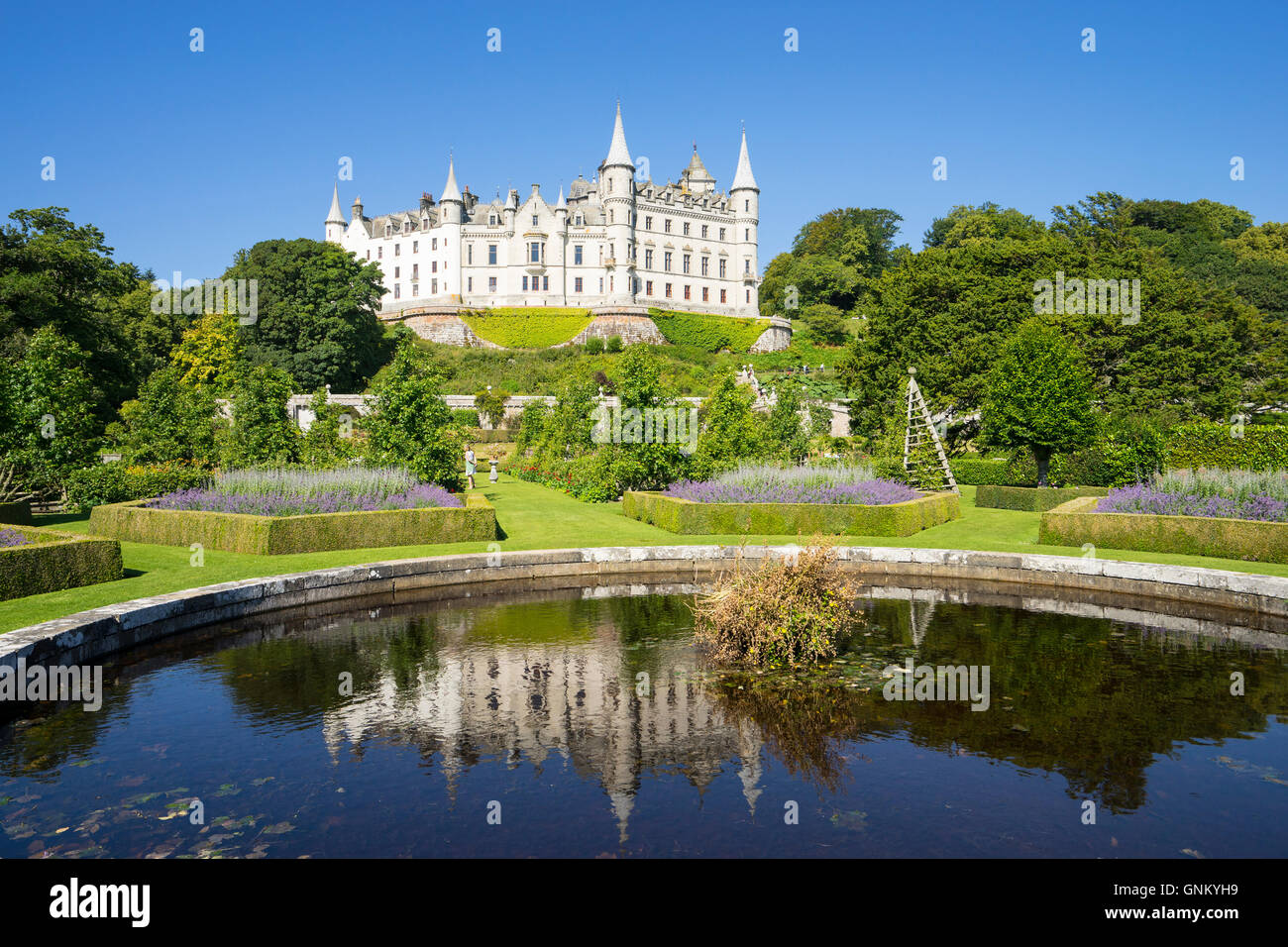 Dunrobin Castle with pond and gardens at Golspie, Highland, Scotland. Castle is seat of the Earl of Sutherland and the Clan Suth Stock Photo