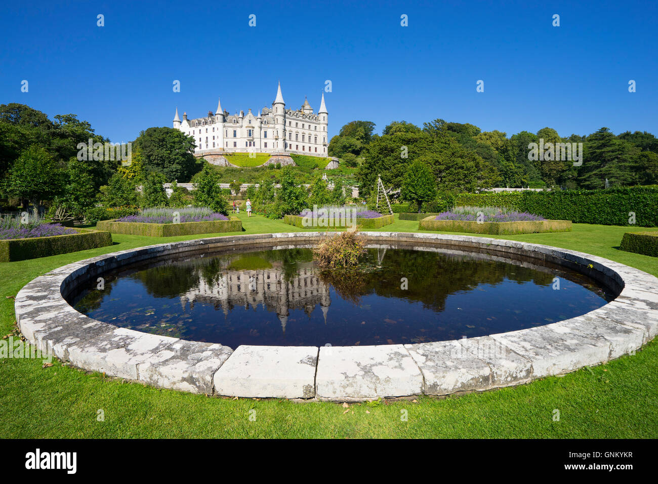 Dunrobin Castle with pond and gardens at Golspie, Highland, Scotland. Castle is seat of the Earl of Sutherland and the Clan Suth Stock Photo