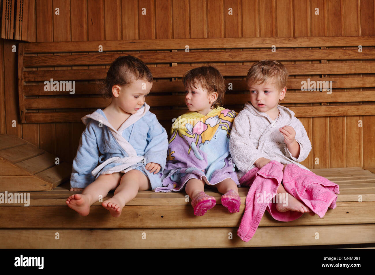 three funny children in sauna Stock Photo Alamy