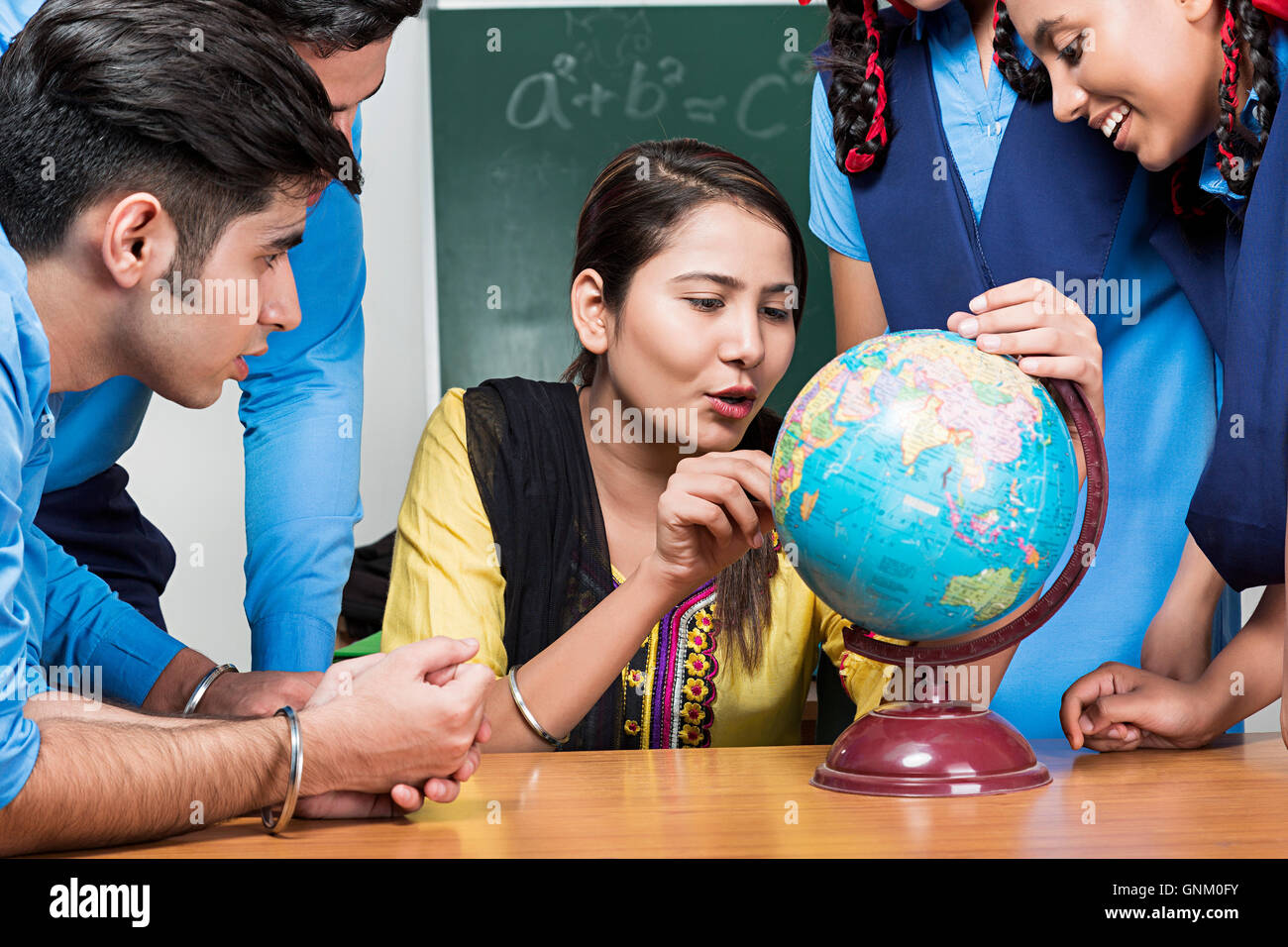 5 Rural School Student and Teacher Classroom Sitting Searching World globe Studying Stock Photo