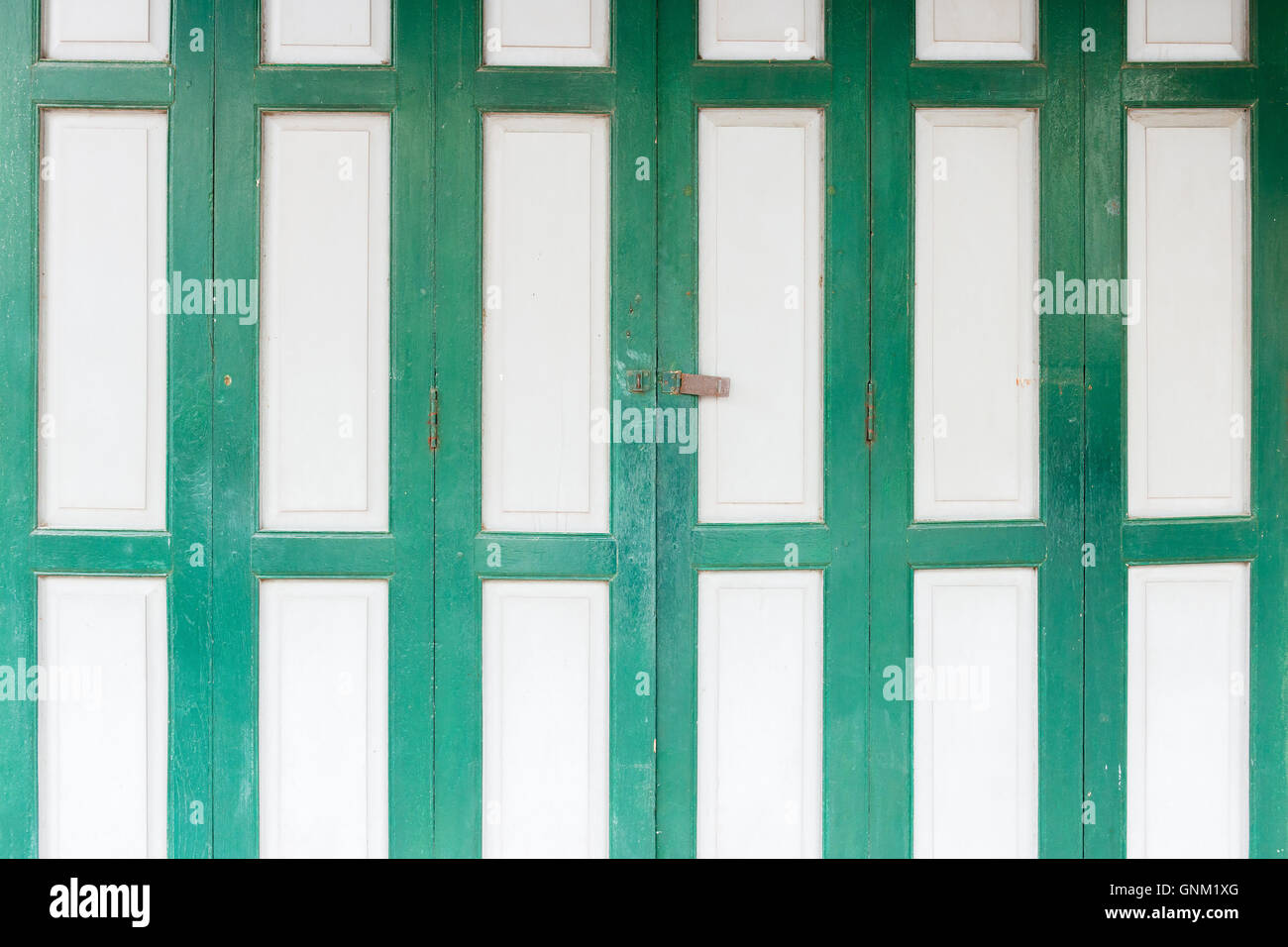 The old grunge folding door closed. Stock Photo