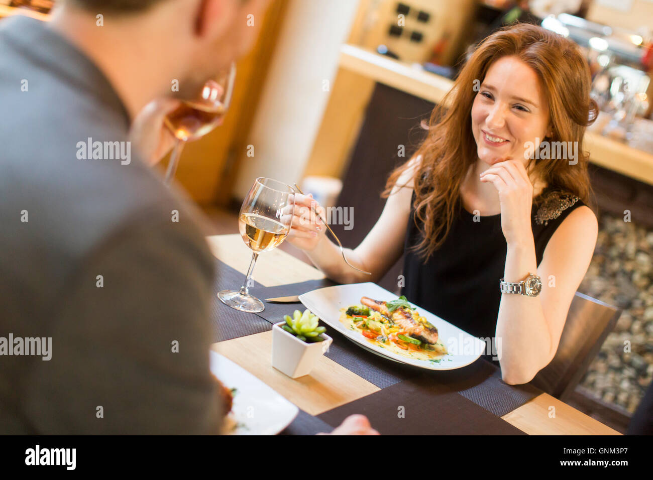 Young couple in the restaurant and have a romantic dinner Stock Photo