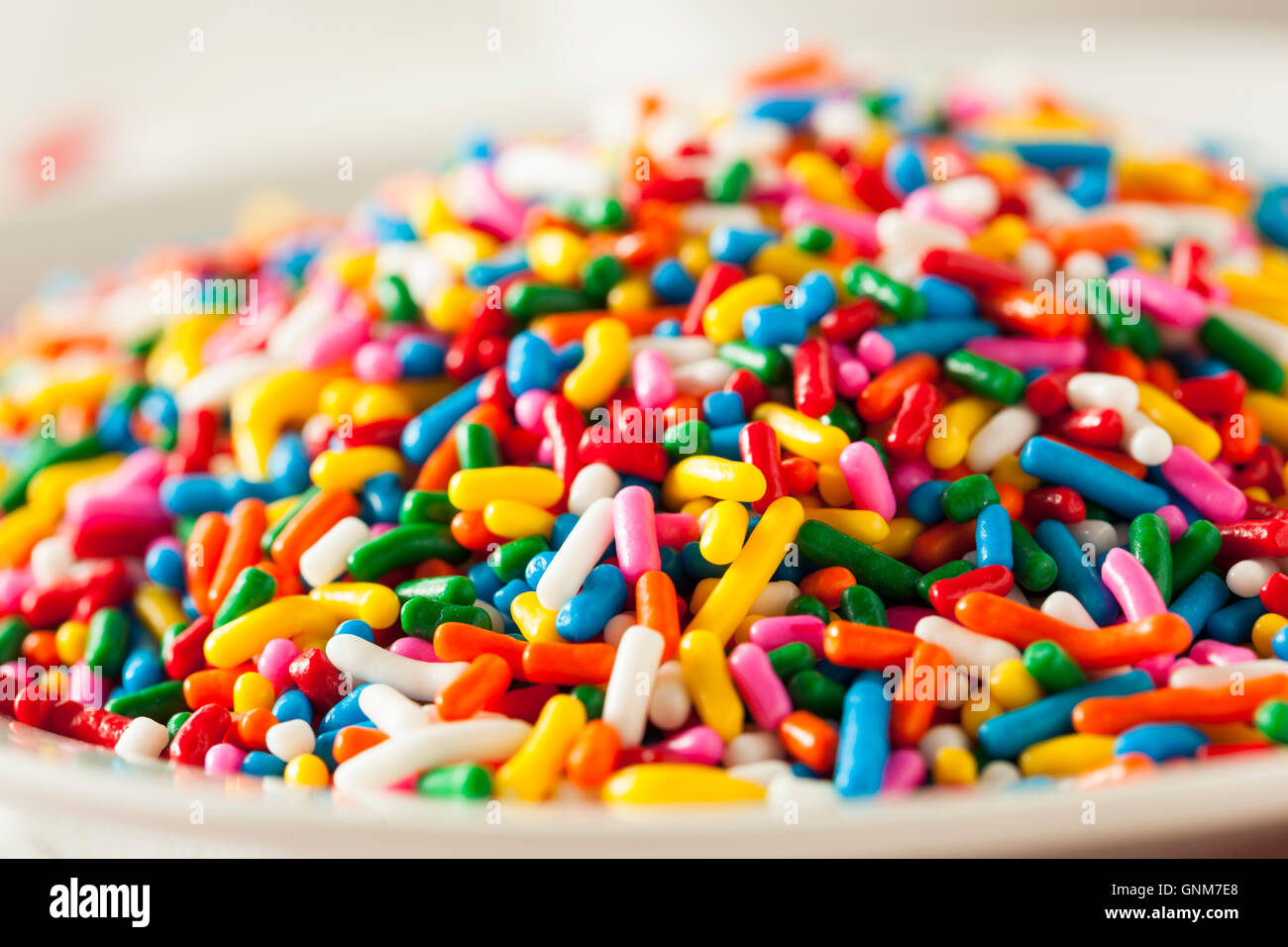 Bright Colored Rainbow Sprinkles in a Bowl Stock Photo