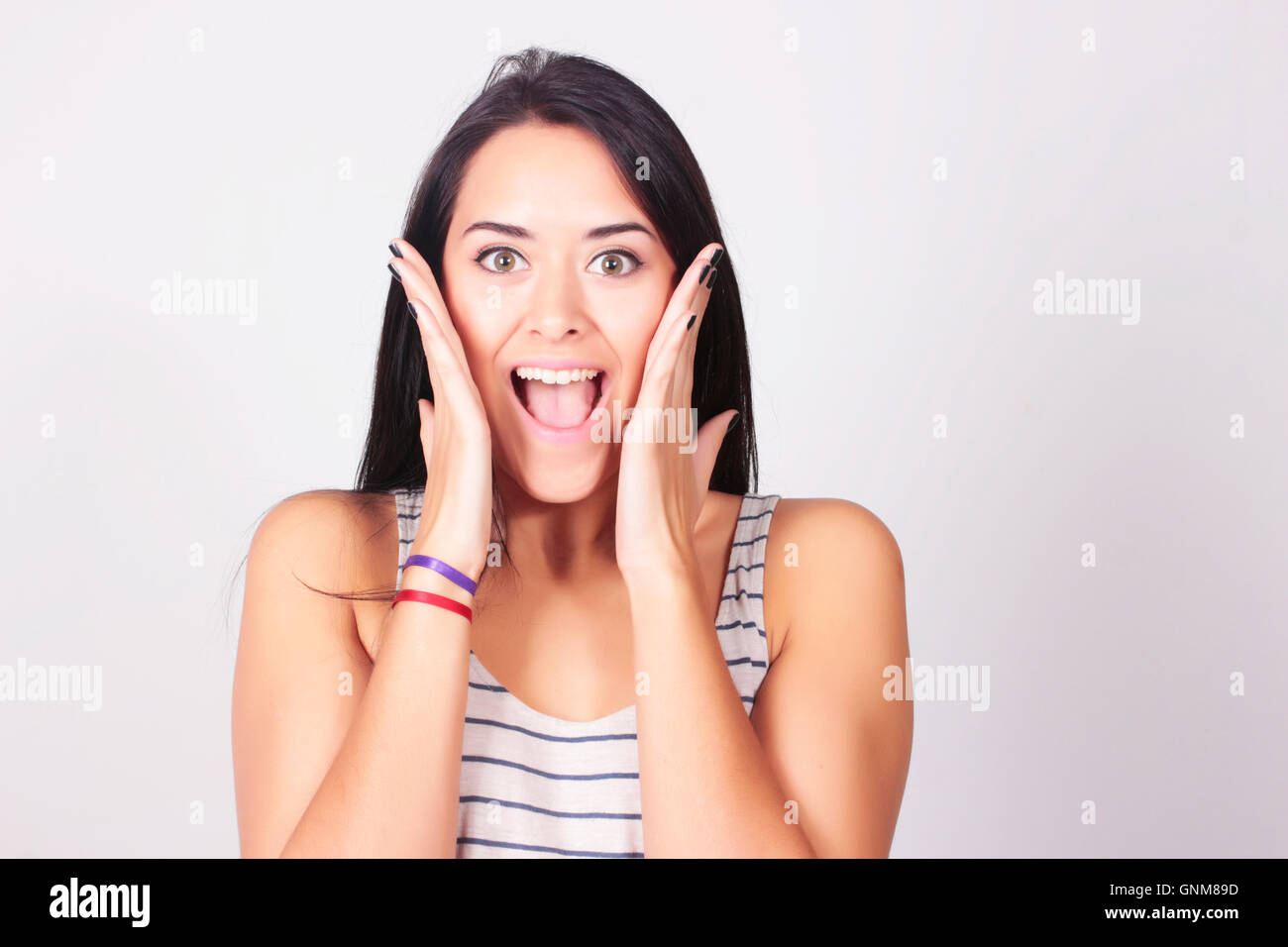 Surprised happy young woman. Caucasian woman with surprised expression. Amazement. Stock Photo