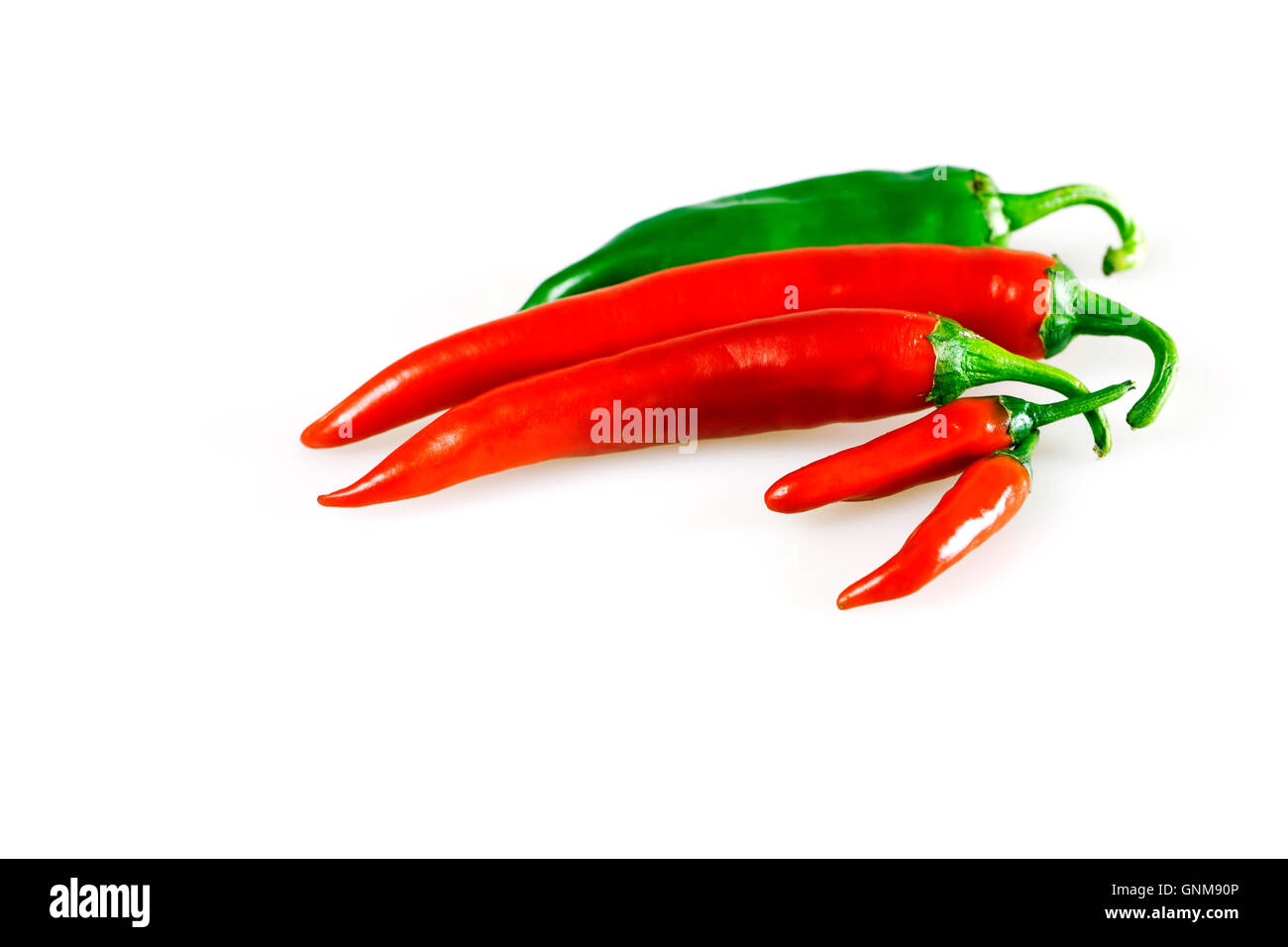 Red and green chilly pepper on a white background Stock Photo - Alamy