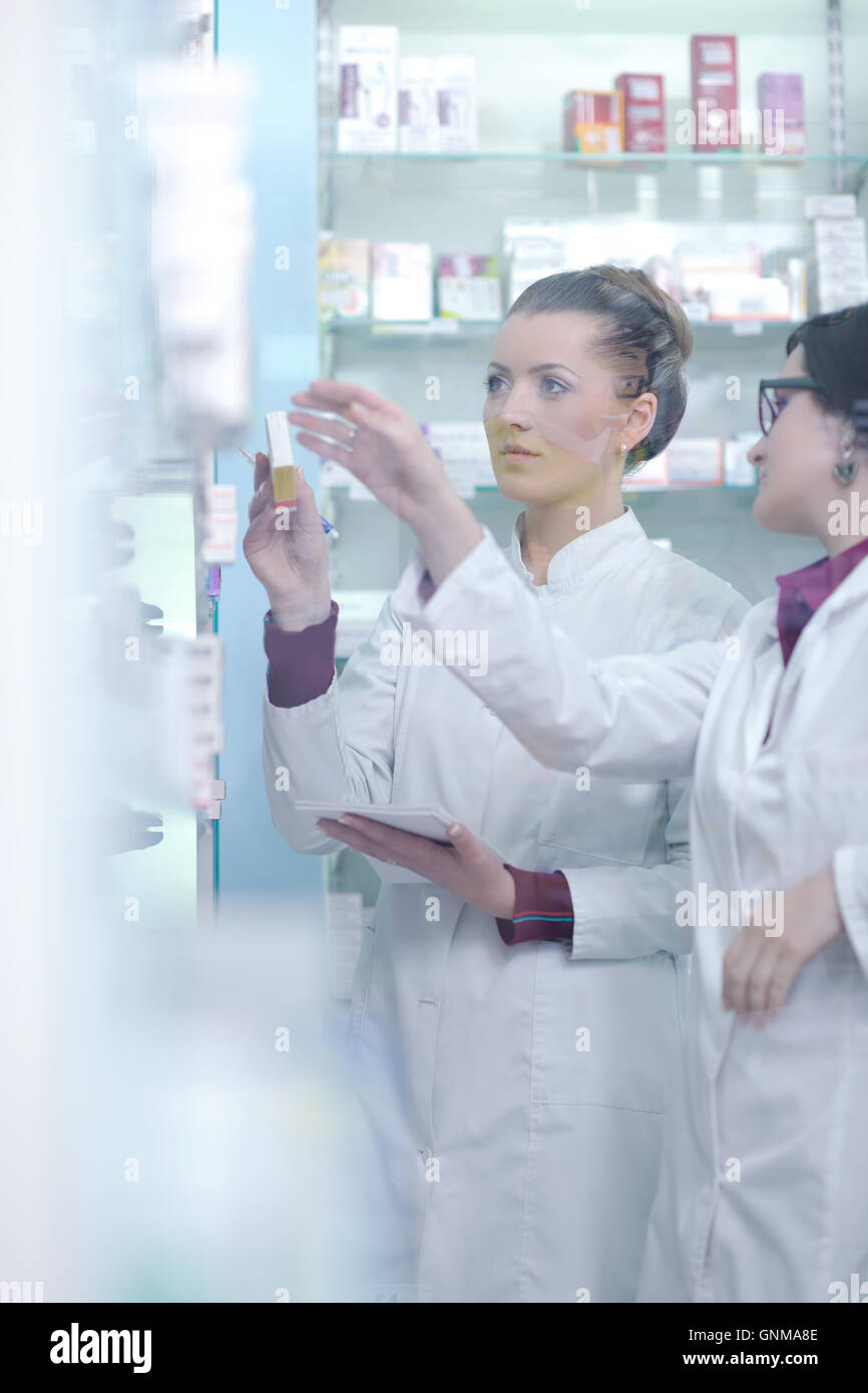 team of pharmacist chemist woman in pharmacy drugstore Stock Photo - Alamy