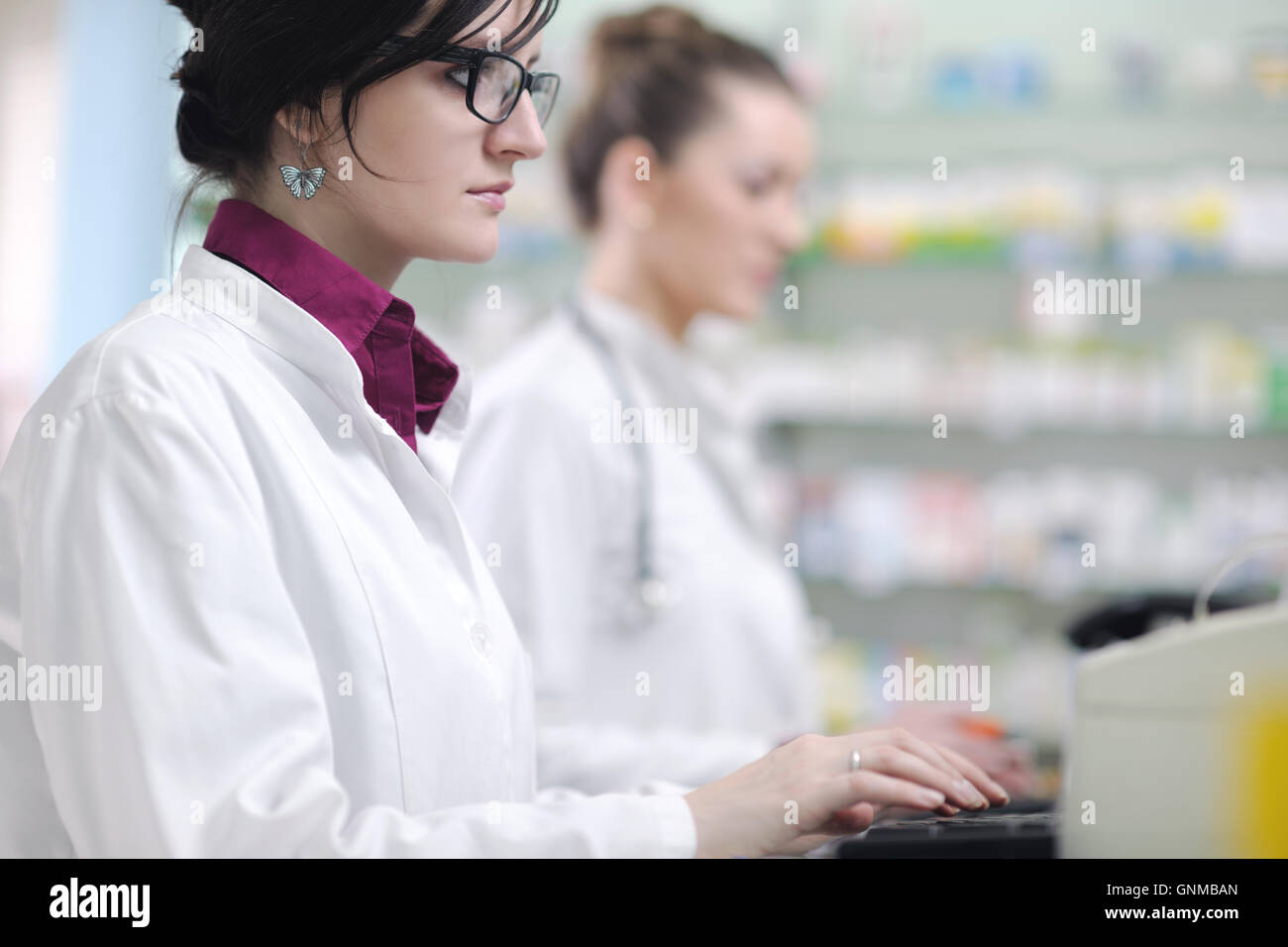 team of pharmacist chemist woman in pharmacy drugstore Stock Photo - Alamy